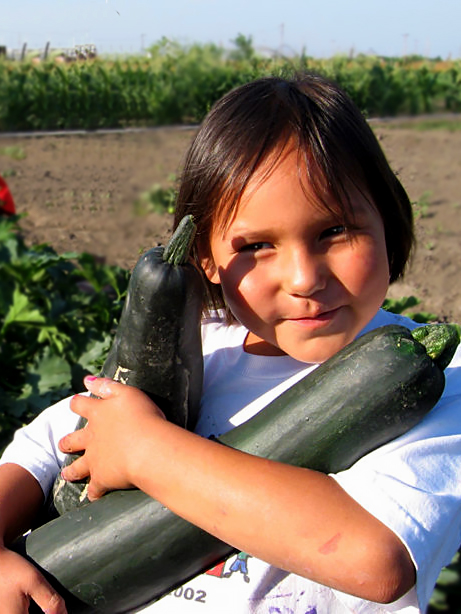 native-child-holding-zucchini