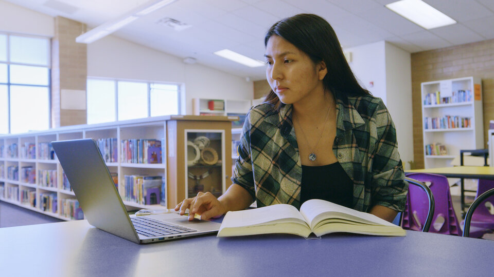 Indigenous student on computer