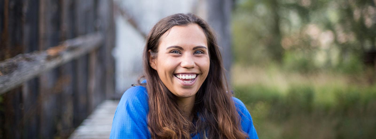 Indigenous high school student smiling happily for photo